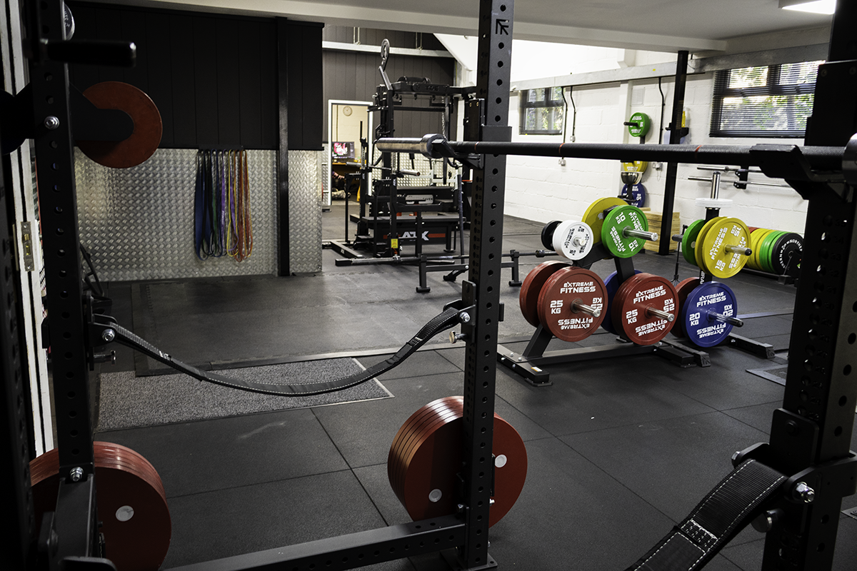 Barbell floor with racks and platforms at Iron Raven gym, Tonbridge